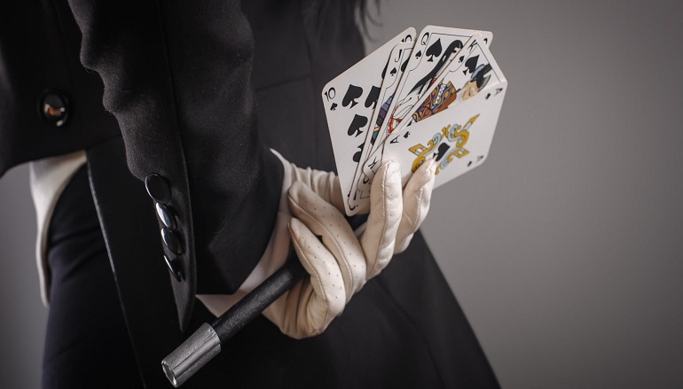 magician-hands-behind-back-2000x900
